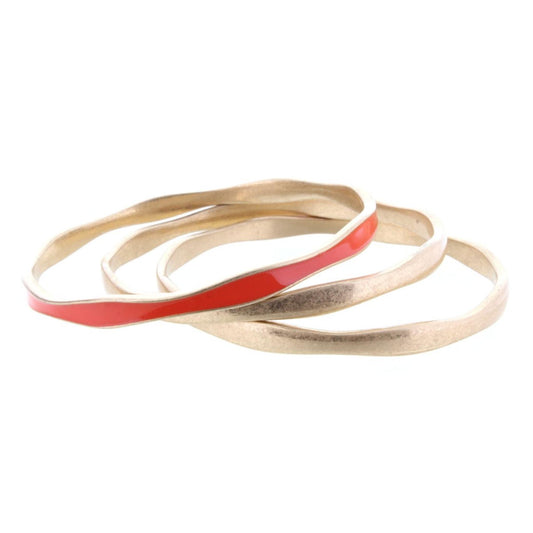 3 Gold Wavy Bangle Bracelets with One Orange Epoxy Accent