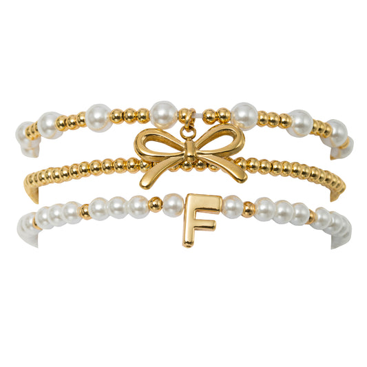 18K Gold Plated Set of 3 Gold, Pearl Beaded Stretch Bracelet with Gold Bow & Initial "F"